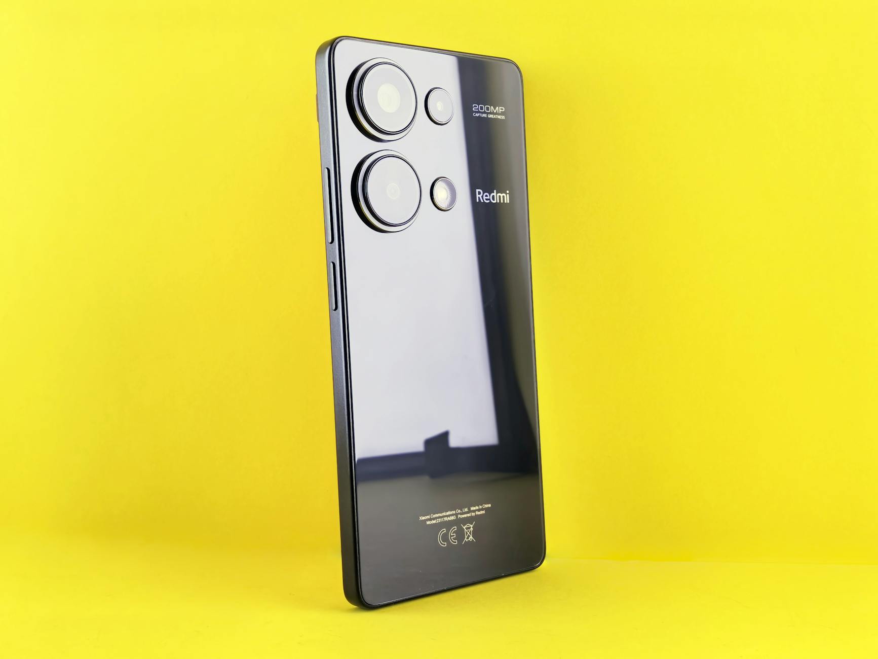 Stylish smartphone on a yellow backdrop for a modern tech look.