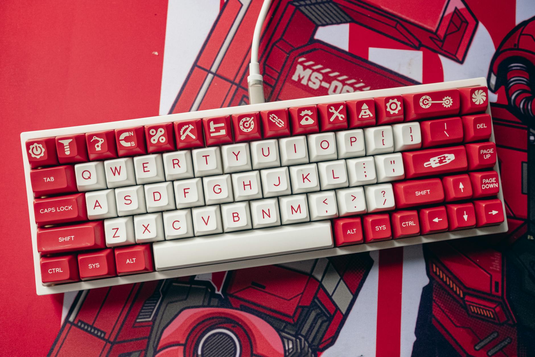 Aesthetic top view of a custom mechanical keyboard with unique red and white keycaps.