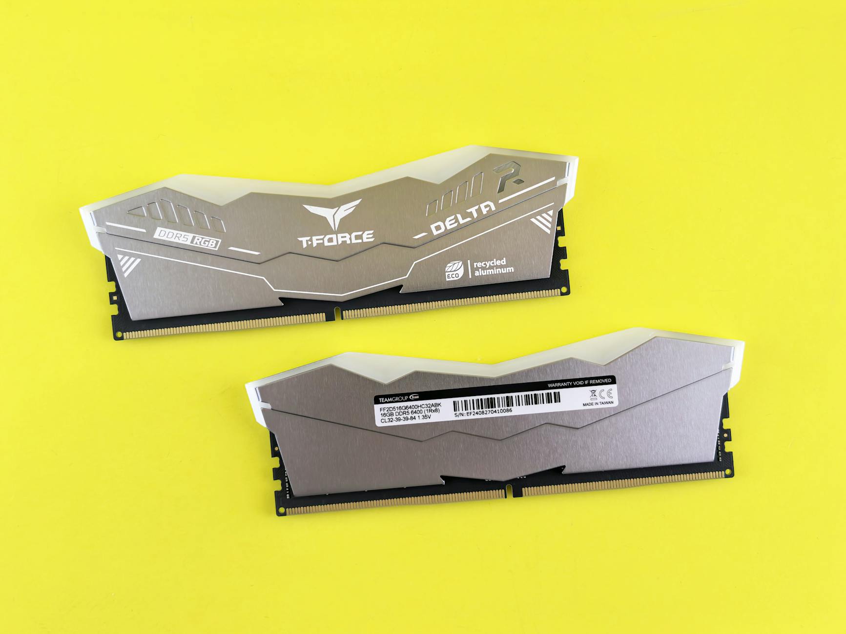 T-Force Delta RGB DDR5 memory modules on vibrant yellow surface.
