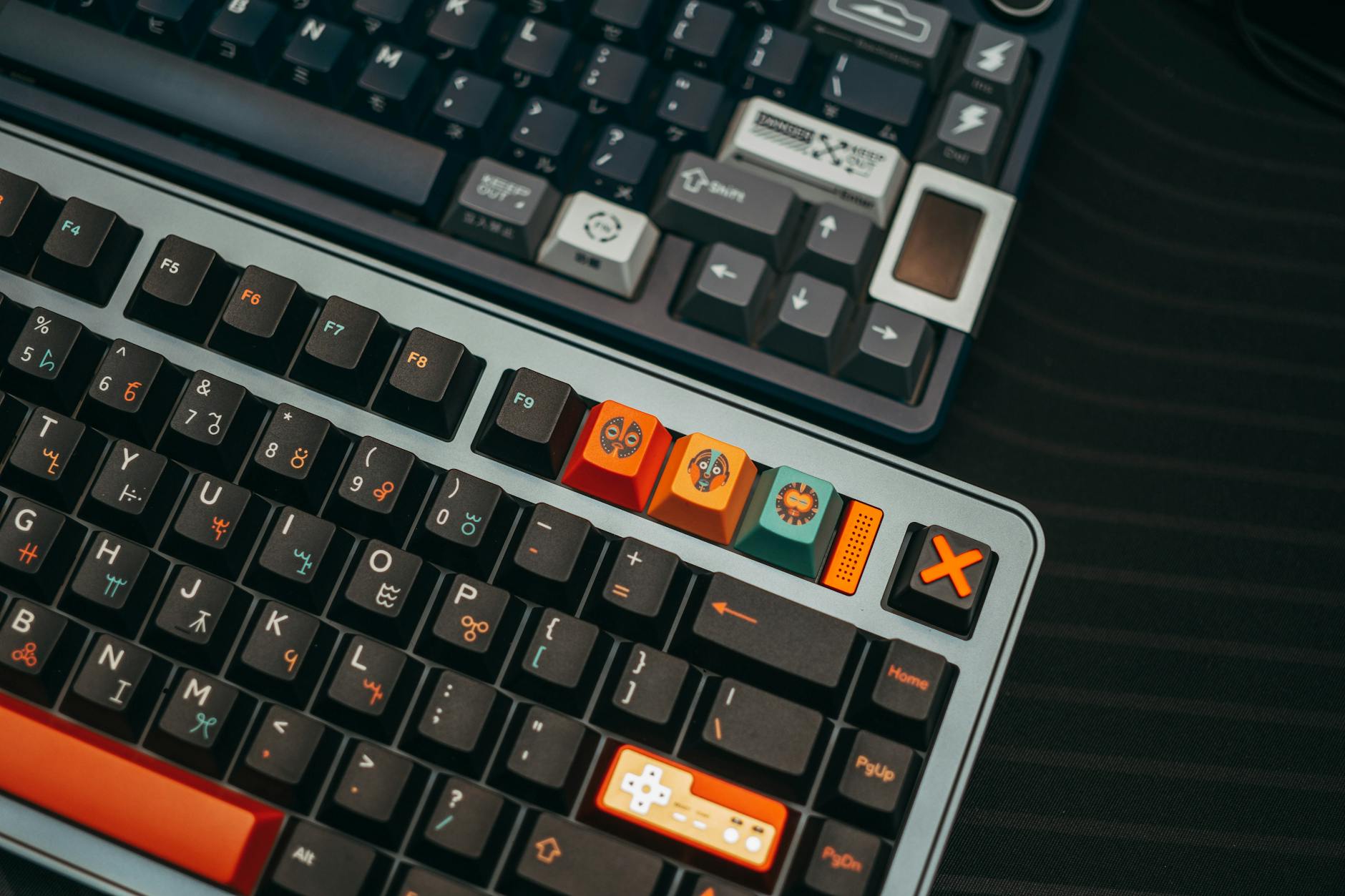 Detailed close-up of two custom mechanical keyboards with colorful keycaps and unique designs.